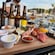 A platter of Norwegian seafood and sauces with 4 bottles of beer for tasting